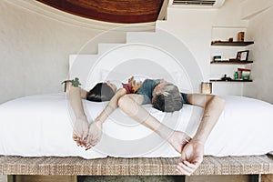 Honeymoon couple relaxing in a hotel room