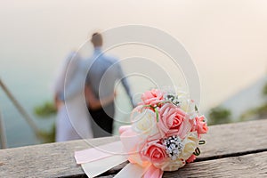 Honeymoon couple romantic in love at beach sunset. Newlywed happy young couple embracing enjoying sea sunset during travel