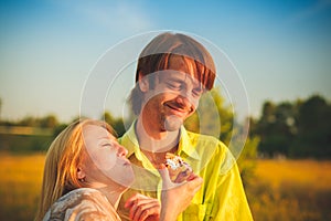 Honeymoon couple romantic in love at field and trees sunset. Newlywed happy young couple embracing enjoying nature