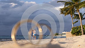 Honeymoon couple on Seven Mile Beach, Cayman Islands