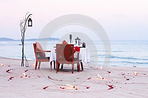 Honeymoon dinner table on island beach in Thailand