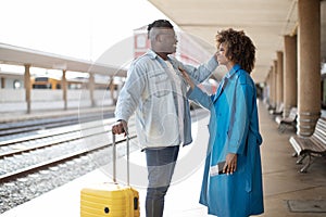 Honeymoon Trip. Happy Romantic Black Spouses Waiting Train At Railway Station