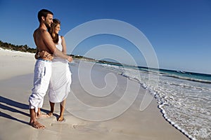 Honeymooners on idyllic beach