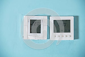 A Honeywell programmable thermostat to control the air conditioner and heater in a home. air conditioning system control unit on