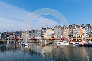 Harbor of Honfleur, France, Normandy, traditional houses and boats in the old harbor basin