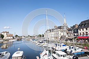 Traditional houses and boats in the old harbor of Honfleur. Normandy, France