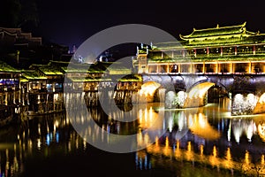 Hong Bridge at night in Fenghuang Ancient town, Hunan province