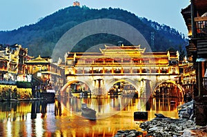 Hong bridge during twilight over the Tuojiang River Tuo Jiang River in Fenghuang old city Phoenix Ancient Town,Hunan