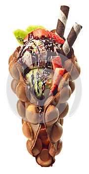 Hong kong or bubble waffle with ice cream and fruits photo