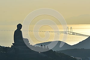Hong kong buddha statue and Hong Kong-Zhuhai-Macao Bridge photo