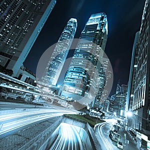 Hong Kong business district at night with light trails