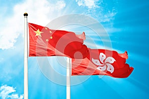 Hong Kong and China flags are fluttering in the breeze