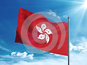 Hong Kong flag waving in the blue sky