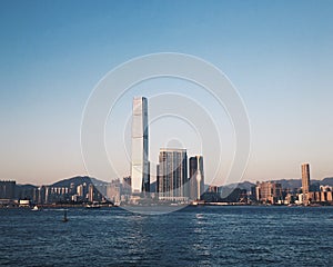 Hong Kong International Commerce Centre skyscraper seascape at sunset. ICC, the tallest building in Hong Kong, is seen from river photo