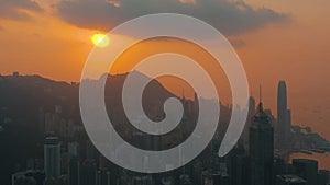 Hong Kong - May 2018: Aerial view of a sunset over Victoria Peak, Victoria Harbour, Hong Kong downtown.