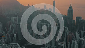 HONG KONG - MAY 2018: Aerial view of a sunset over Victoria Peak, Victoria Harbour, Hong Kong downtown.