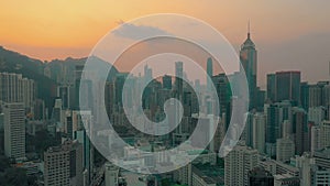 HONG KONG - MAY 2018: Aerial view of a sunset over Victoria Peak, Victoria Harbour, Hong Kong downtown.