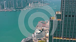 HONG KONG - MAY 2018: Aerial view of Victoria bay from Kowloon district side in 4k. Skyscrapers on the waterfront.