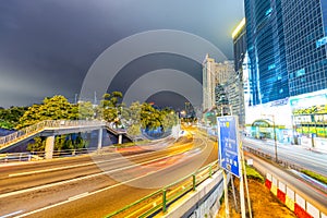 HONG KONG - MAY 4, 2014: City streets and traffic at night. Hong Kong hosts 15 million tourists annually