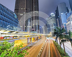 Hong Kong at night with city street and modern buildings