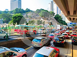 Red city taxis in road traffic, Hong Kong