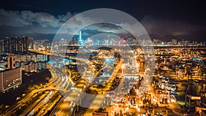 Hong Kong port, highway traffic, and the Symphony of Lights show on buildings in city at night. Asia tourism, logistic business