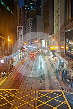 HONG KONG, HONG KONG SAR - NOVEMBER 17, 2018: Light blur motion scene of tram and traffic in central Hong Kong at night. There are