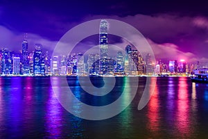 Hong Kong skyline at night with Reflection of light.