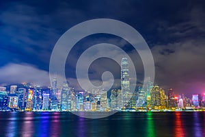 Hong Kong skyline at night with Reflection of light.