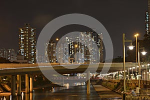 Hong Kong skyscraper bridge above river