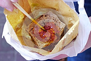 Hong Kong street food: Stinky tofu, chili sauce, paper bag