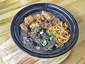 Hong Kong style pork rib beef claypot rice laid out on a wooden board