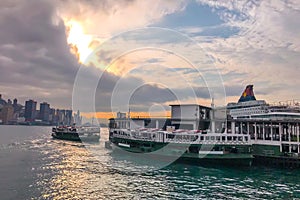 Hong Kong traditional vintage ferry near the city pier with dramantic sky