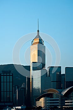 Skyline of skyscrapers at Wan Chai district at dawn, with the Hong Kong Convention & Exhibition Centre in the foreground