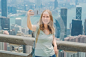 Hong Kong Victoria Peak woman taking selfie stick picture photo