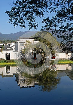 Hongcun Ancient Town in Anhui Province, China. Old building with its reflection in Nanhu Lake