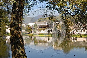 Hongcun Ancient Town in Anhui Province, China. Old building with its reflection in Nanhu Lake