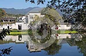 Hongcun Ancient Town in Anhui Province, China. Old building with its reflection in Nanhu Lake