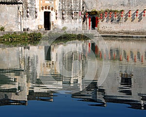 Hongcun Ancient Town in Anhui Province, China. Reflections of old buildings in the water of Moon Pond