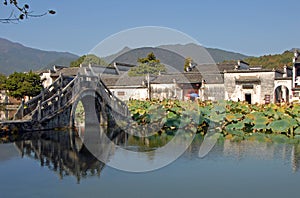Hongcun Ancient Town in Anhui Province, China. The stone bridge crossing Nanhu Lake