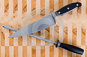 Honing Steel and French Knife Crossed photo