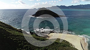 Honolulu, Hawaii, low angle view with drone camera moving forward, green island in the middle of the bay