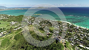 Honolulu, Hawaii, low angle view with drone camera moving forward, people hiking to pill box world war II monument