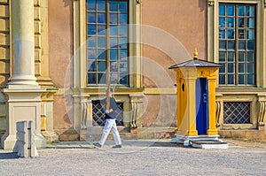 Honor guard soldier is on duty and booth post near central entrance of Swedish Royal Palace