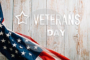 In honor of Veterans Day, American flags against a wooden backdrop