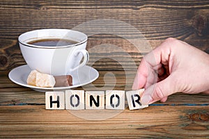 Honor. Wooden letters on the office desk, informative and communication background