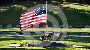 Honoring and Remembering with the American Flag on Graves: Memorial Day Tributes. Concept Memorial