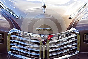 Hood & Grille of a Classic Tan Lincoln Sedan