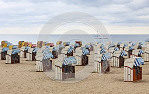 Hooded beach chairs strandkorb at Baltic seacoast in Travemunde, Germany