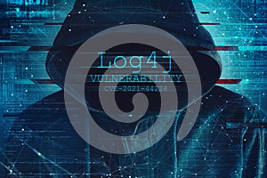 Hooded computer hacker in cybersecurity vulnerability Log4J concept photo